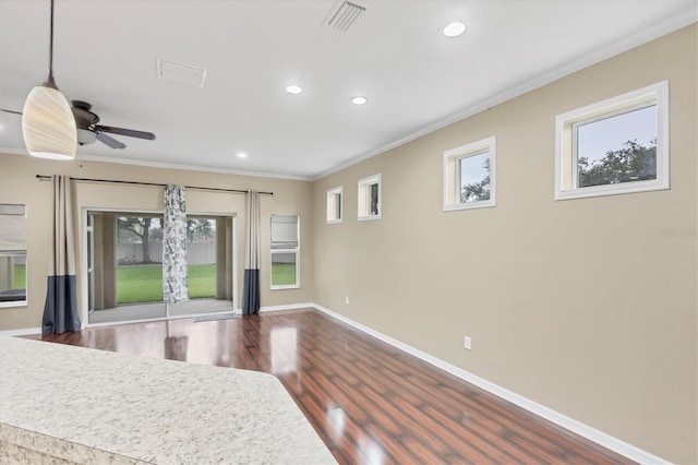 11571 84th Street Cir E Unit 106, Parrish, FL 34219 - kitchen featuring dark wood-style floors, healthy amount of natural light, recessed lighting, crown molding, and a ceiling fan