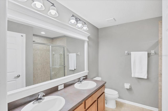 11571 84th Street Cir E Unit 106, Parrish, FL 34219 - bathroom featuring a stall shower, double vanity, and tile patterned flooring
