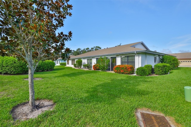 2510 Locksley St Unit 2510, Sun City Center, FL 33573 - back of property with a lawn and stucco siding
