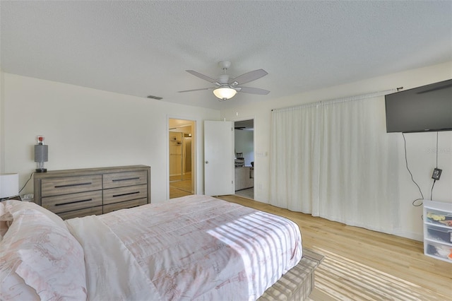 2510 Locksley St Unit 2510, Sun City Center, FL 33573 - bedroom with wood finished floors, a textured ceiling, and ceiling fan