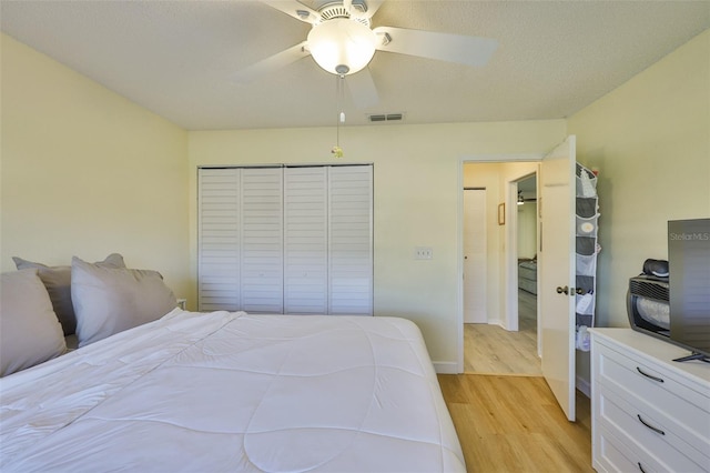 2510 Locksley St Unit 2510, Sun City Center, FL 33573 - bedroom featuring light wood-style flooring, a closet, and ceiling fan
