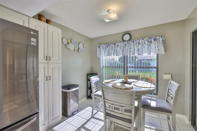 2510 Locksley St Unit 2510, Sun City Center, FL 33573 - dining room featuring light tile patterned floors and a textured ceiling