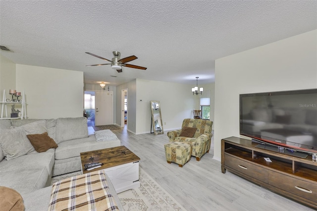 2510 Locksley St Unit 2510, Sun City Center, FL 33573 - living room with wood finished floors, ceiling fan, and a textured ceiling