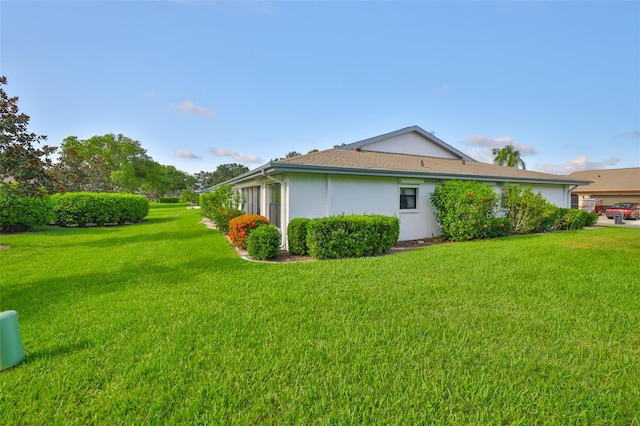 2510 Locksley St Unit 2510, Sun City Center, FL 33573 - view of side of property with a yard and stucco siding