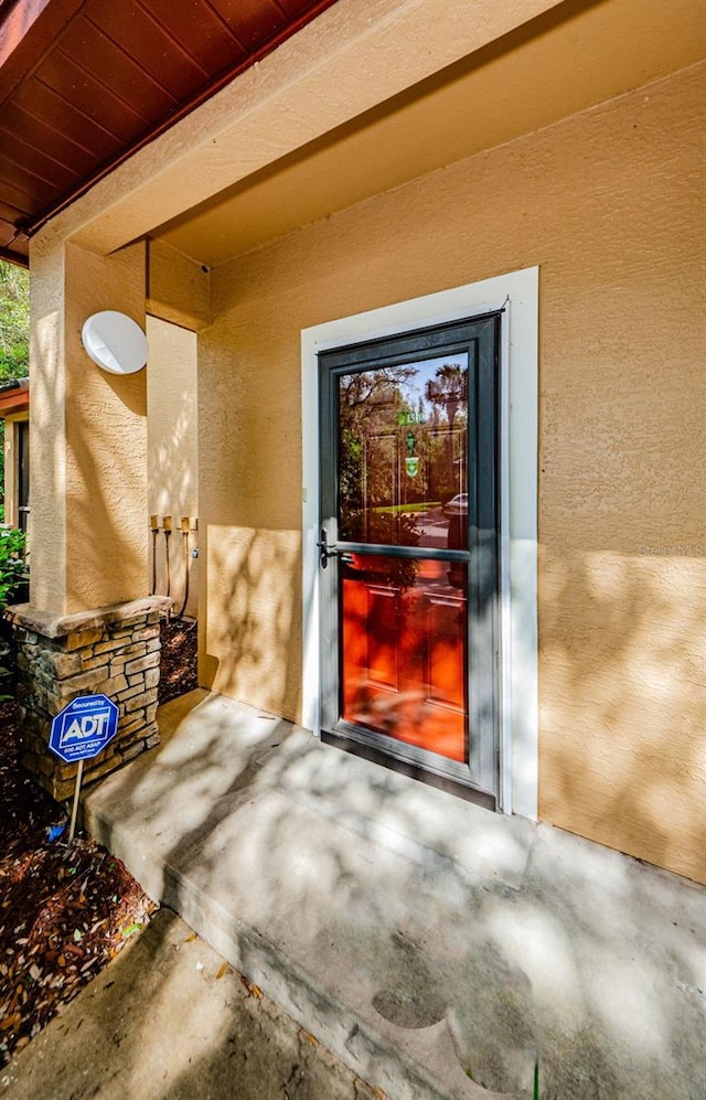 2148 Chianti Pl Unit 1310, Palm Harbor, FL 34683 - view of exterior entry featuring stucco siding