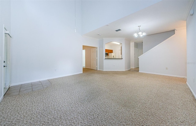 2148 Chianti Pl Unit 1310, Palm Harbor, FL 34683 - unfurnished living room featuring carpet flooring and a chandelier