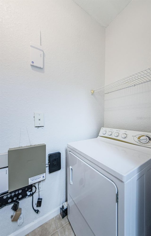 2148 Chianti Pl Unit 1310, Palm Harbor, FL 34683 - washroom with washer / clothes dryer and light tile patterned flooring