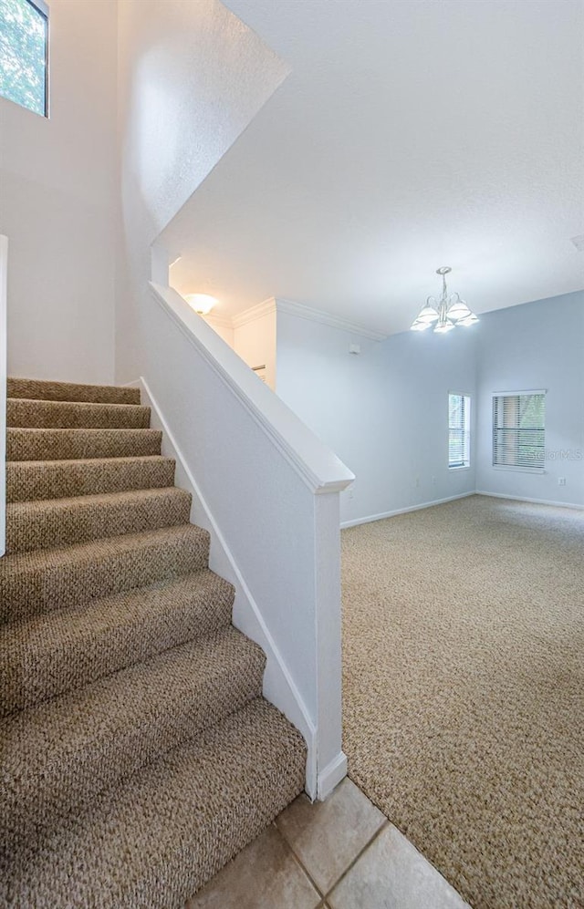 2148 Chianti Pl Unit 1310, Palm Harbor, FL 34683 - stairs with a chandelier and carpet flooring