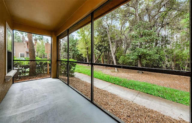 2148 Chianti Pl Unit 1310, Palm Harbor, FL 34683 - unfurnished sunroom with view of scattered trees