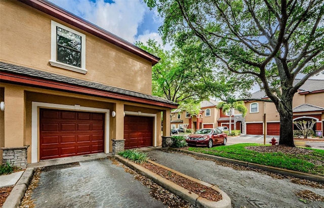 2148 Chianti Pl Unit 1310, Palm Harbor, FL 34683 - garage featuring asphalt driveway