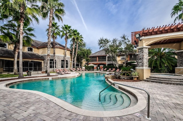 2148 Chianti Pl Unit 1310, Palm Harbor, FL 34683 - community pool featuring a patio