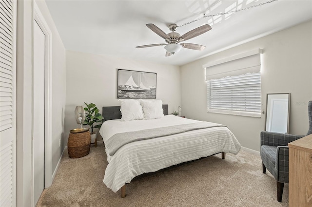 500 Glennes Ln Unit 206, Dunedin, FL 34698 - carpeted bedroom featuring baseboards and ceiling fan