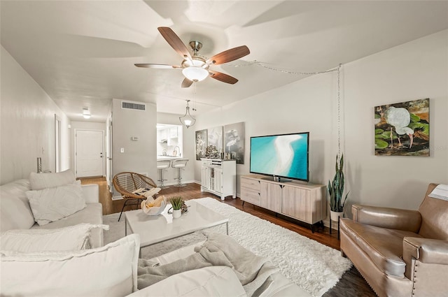 500 Glennes Ln Unit 206, Dunedin, FL 34698 - living area featuring wood finished floors and ceiling fan