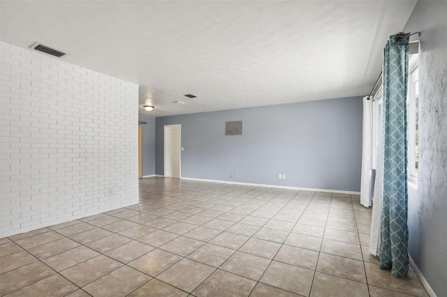 992 20th St SW, Largo, FL 33770 - unfurnished room with light tile patterned floors and baseboards