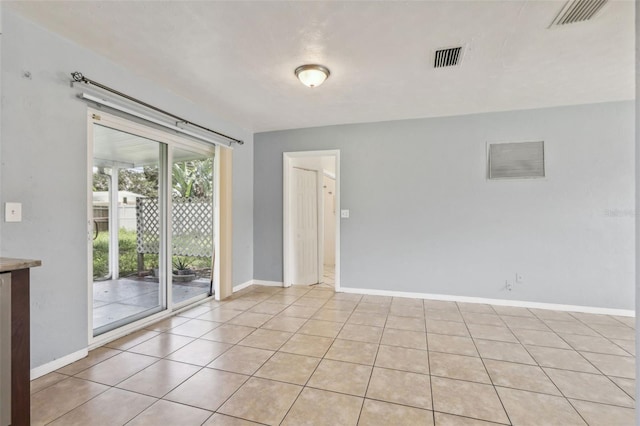 992 20th St SW, Largo, FL 33770 - empty room featuring baseboards and light tile patterned floors