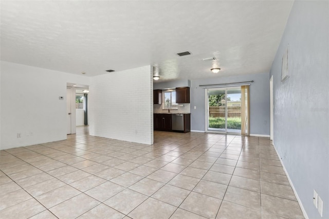 992 20th St SW, Largo, FL 33770 - unfurnished living room featuring light tile patterned floors