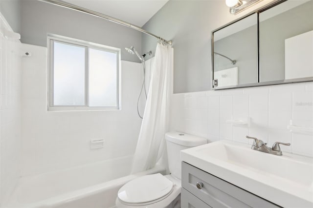 992 20th St SW, Largo, FL 33770 - bathroom featuring shower / bath combo, vanity, and tile walls
