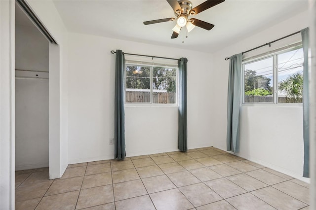 992 20th St SW, Largo, FL 33770 - unfurnished bedroom with a closet and ceiling fan
