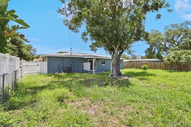 992 20th St SW, Largo, FL 33770 - rear view of house with a fenced backyard