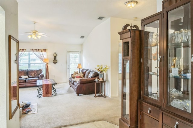 1754 Turtle Rock Dr, Lakeland, FL 33803 - carpeted living room with vaulted ceiling and a ceiling fan