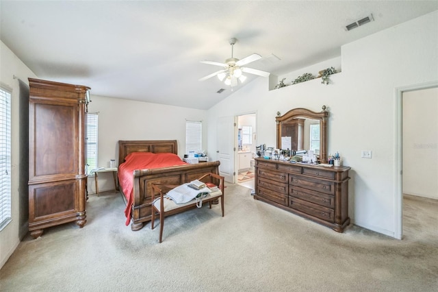 1754 Turtle Rock Dr, Lakeland, FL 33803 - bedroom featuring light carpet, vaulted ceiling, ceiling fan, and ensuite bath