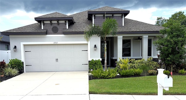 12312 Rose Haven Blvd, New Port Richey, FL 34654 - view of front of property featuring a shingled roof, concrete driveway, a garage, and a front lawn