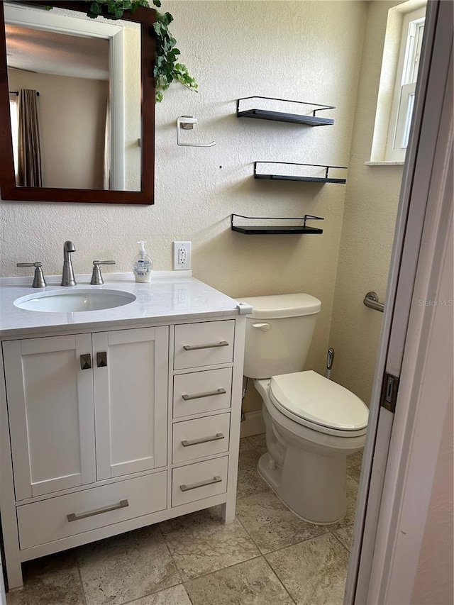 3260 Parkway Pl, Palm Harbor, FL 34684 - half bathroom with vanity and a textured wall