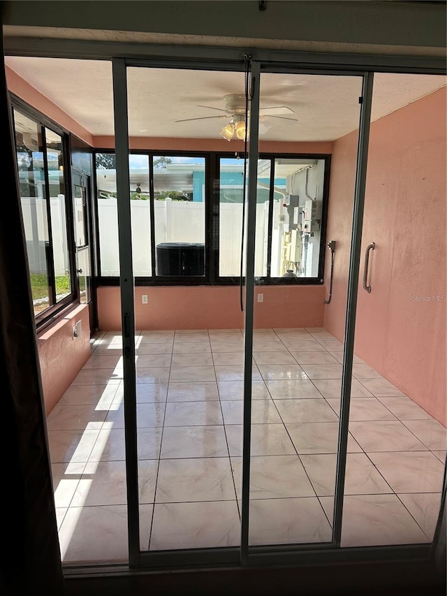 3260 Parkway Pl, Palm Harbor, FL 34684 - unfurnished sunroom with ceiling fan