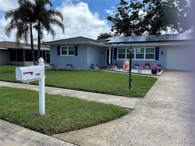 3260 Parkway Pl, Palm Harbor, FL 34684 - single story home featuring stucco siding, solar panels, a front lawn, and an attached garage