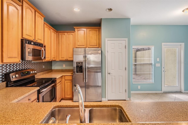 14167 Stilton St, Tampa, FL 33626 - kitchen with stainless steel appliances, light countertops, light tile patterned floors, tasteful backsplash, and recessed lighting