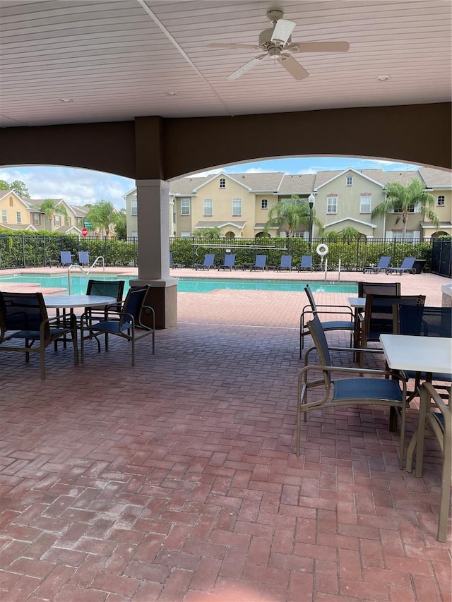 14167 Stilton St, Tampa, FL 33626 - community pool with ceiling fan and a patio area