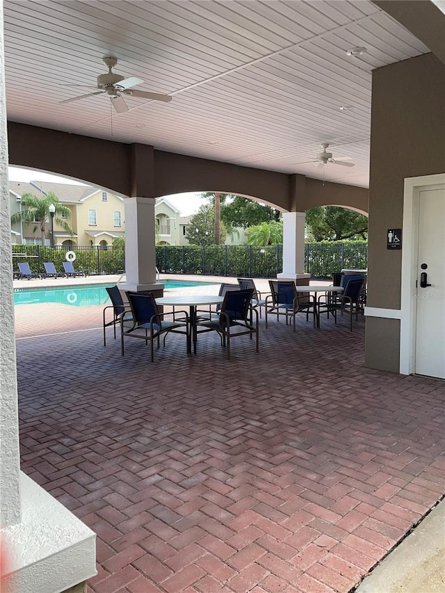 14167 Stilton St, Tampa, FL 33626 - view of patio with a ceiling fan and a community pool