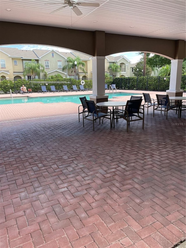 14167 Stilton St, Tampa, FL 33626 - view of patio with a community pool and ceiling fan