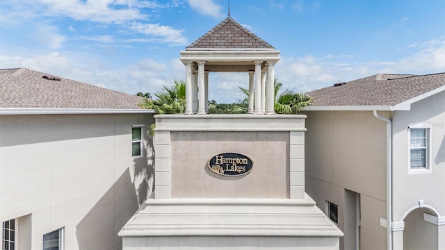 14167 Stilton St, Tampa, FL 33626 - exterior view of stucco siding, a downspout, and gutters