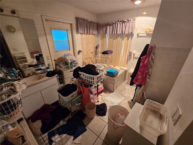 8548 Cypress Lakes Blvd, New Port Richey, FL 34653 - bathroom with vanity, tile patterned floors, and a textured ceiling