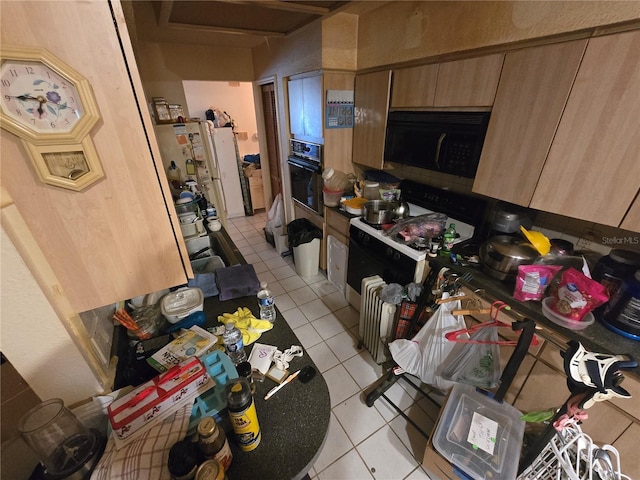 8548 Cypress Lakes Blvd, New Port Richey, FL 34653 - kitchen featuring black appliances and light tile patterned floors