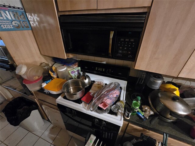 8548 Cypress Lakes Blvd, New Port Richey, FL 34653 - kitchen view of black microwave and decorative backsplash