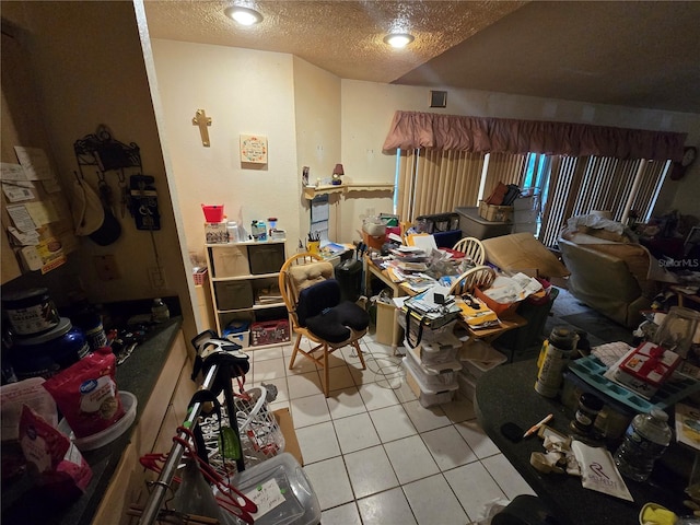 8548 Cypress Lakes Blvd, New Port Richey, FL 34653 - bedroom with light tile patterned floors and a textured ceiling