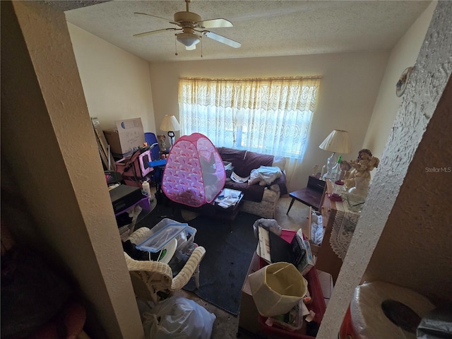 8548 Cypress Lakes Blvd, New Port Richey, FL 34653 - living room featuring ceiling fan and a textured ceiling