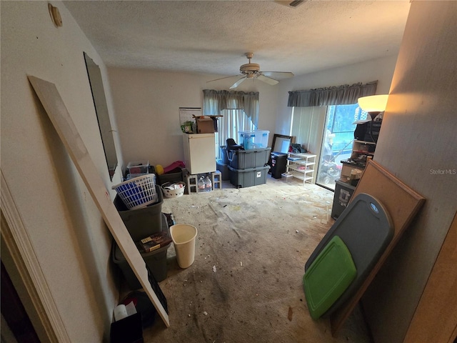 8548 Cypress Lakes Blvd, New Port Richey, FL 34653 - carpeted living area with a textured ceiling and ceiling fan