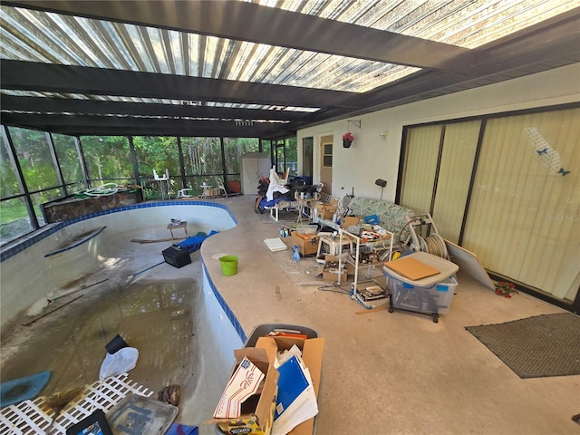 8548 Cypress Lakes Blvd, New Port Richey, FL 34653 - view of pool featuring an empty pool, a lanai, a patio area, and a storage unit