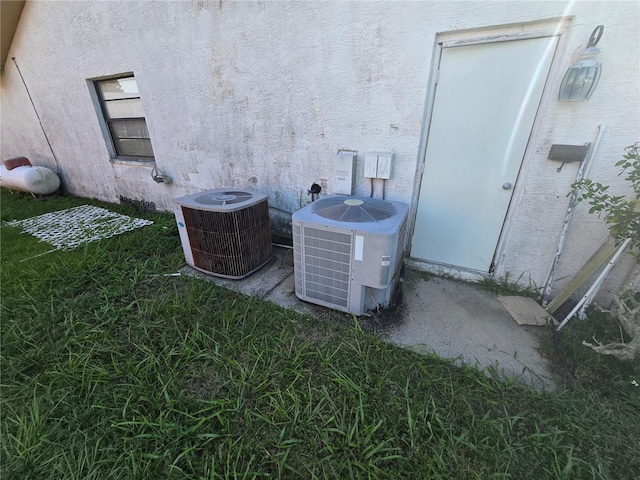 8548 Cypress Lakes Blvd, New Port Richey, FL 34653 - exterior view of a central AC unit and stucco siding