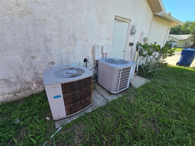 8548 Cypress Lakes Blvd, New Port Richey, FL 34653 - exterior view of a central AC unit and stucco siding