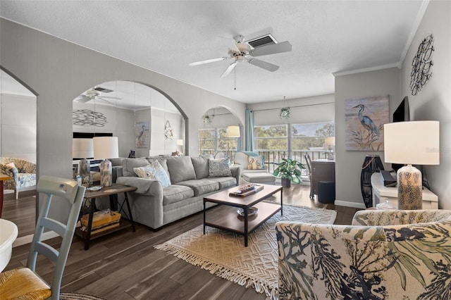 2700 Bayshore Blvd Unit 2312, Dunedin, FL 34698 - living room featuring ceiling fan, wood finished floors, arched walkways, a textured ceiling, and ornamental molding
