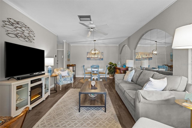 2700 Bayshore Blvd Unit 2312, Dunedin, FL 34698 - living area with a ceiling fan, a chandelier, wood finished floors, arched walkways, and crown molding