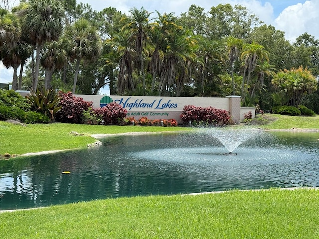 2722 Sherbrooke Ln Unit D, Palm Harbor, FL 34684 - community sign with a lawn and a water view