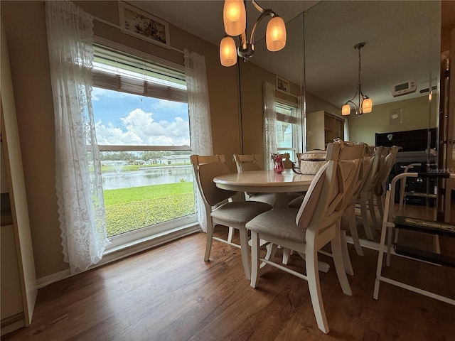 2722 Sherbrooke Ln Unit D, Palm Harbor, FL 34684 - dining area with wood finished floors