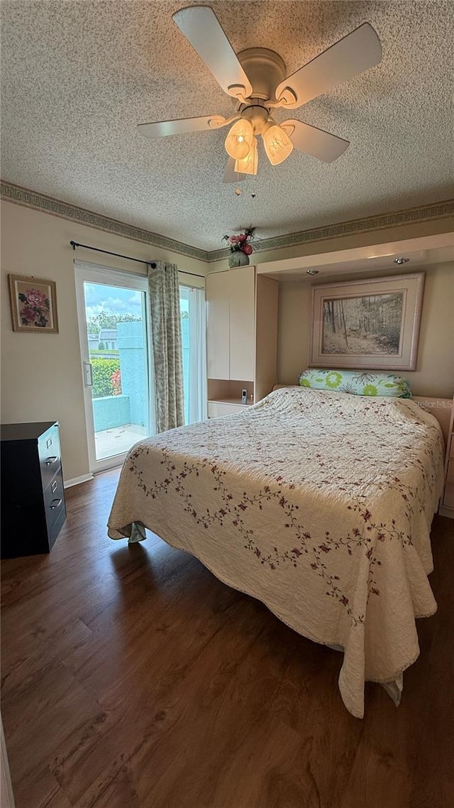 2722 Sherbrooke Ln Unit D, Palm Harbor, FL 34684 - bedroom featuring access to outside, dark wood-style floors, a textured ceiling, and ceiling fan