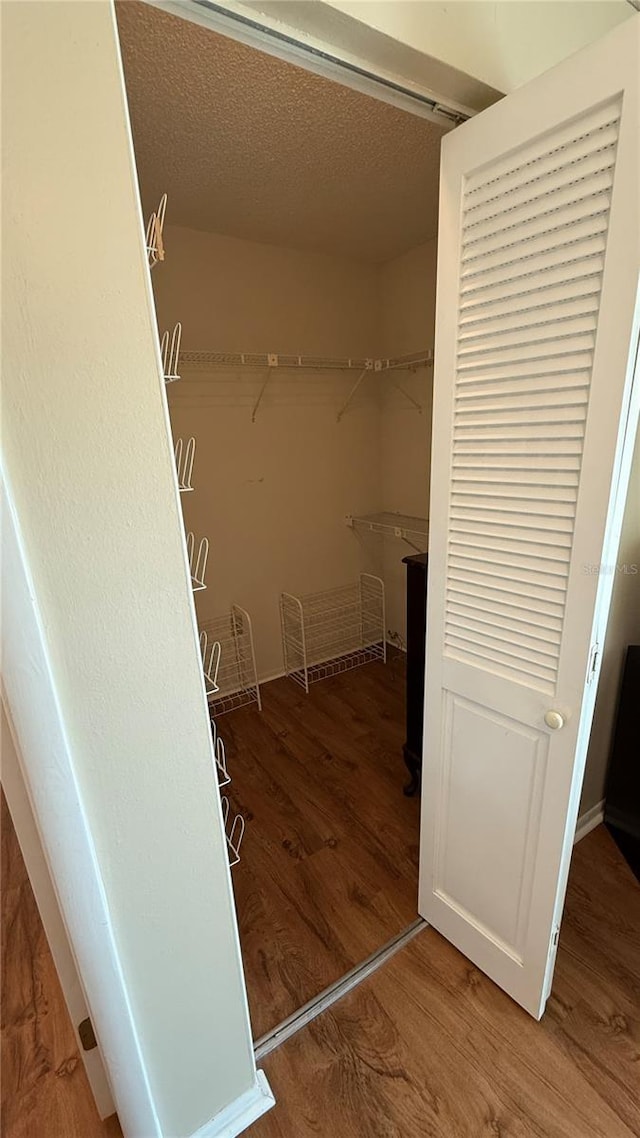 2722 Sherbrooke Ln Unit D, Palm Harbor, FL 34684 - spacious closet with wood finished floors
