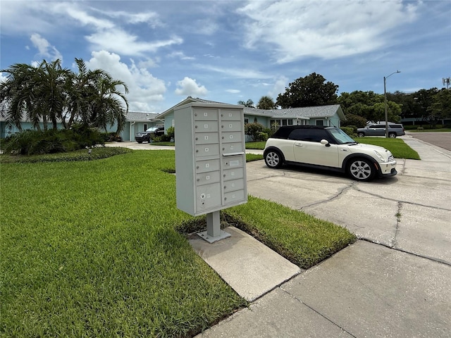 2722 Sherbrooke Ln Unit D, Palm Harbor, FL 34684 - view of vehicle parking featuring mail area